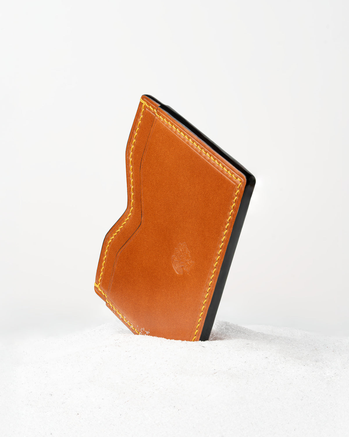 Berling Heirloom Amber card holder, Shell Cordovan, amber - front view, standing in snow