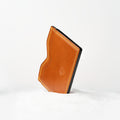 Berling Heirloom Amber card holder, Shell Cordovan, amber - front view, standing in snow