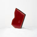 Berling Heirloom Crimson card holder, Shell Cordovan, red - front view, standing in snow