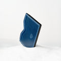 Berling Heirloom Lapis card holder, Shell Cordovan, blue - front view, standing in snow