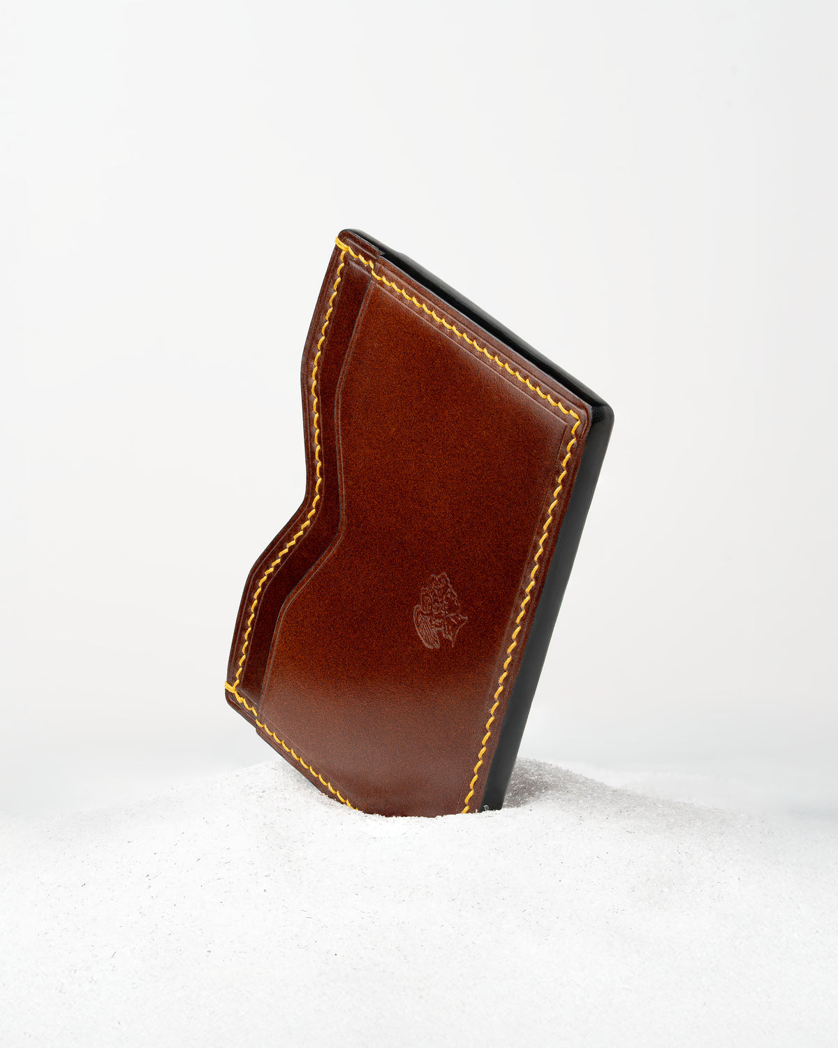 Berling Heirloom Sienna card holder, Shell Cordovan, brown - front view, standing in snow